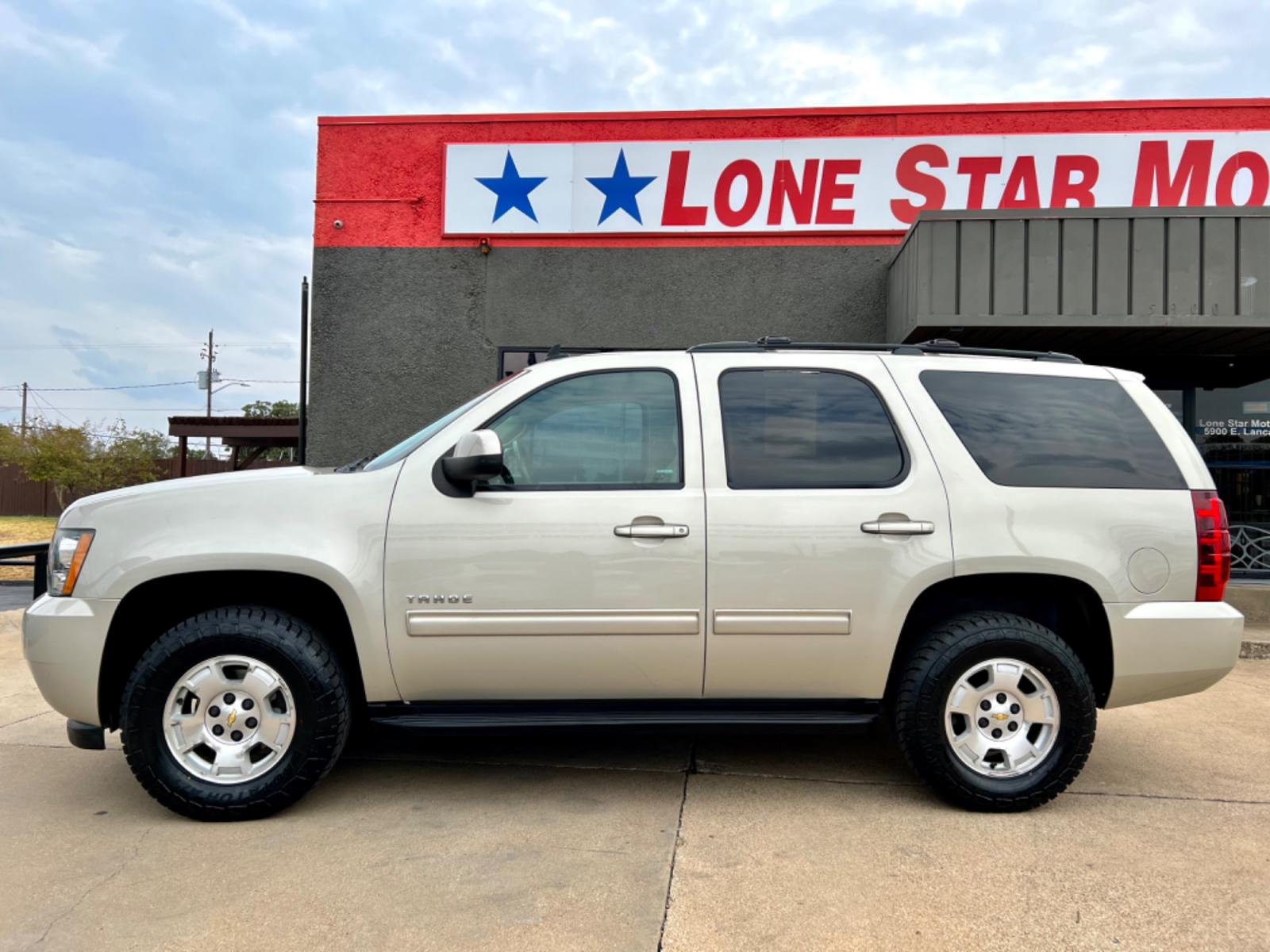 2014 GOLD CHEVROLET TAHOE LS (1GNSCAE04ER) , located at 5900 E. Lancaster Ave., Fort Worth, TX, 76112, (817) 457-5456, 0.000000, 0.000000 - This is a 2014 CHEVROLET TAHOE LS 4 DOOR SUV that is in excellent condition. There are no dents or scratches. The interior is clean with no rips or tears or stains. All power windows, door locks and seats. Ice cold AC for those hot Texas summer days. It is equipped with a CD player, AM/FM radio, AUX - Photo #2